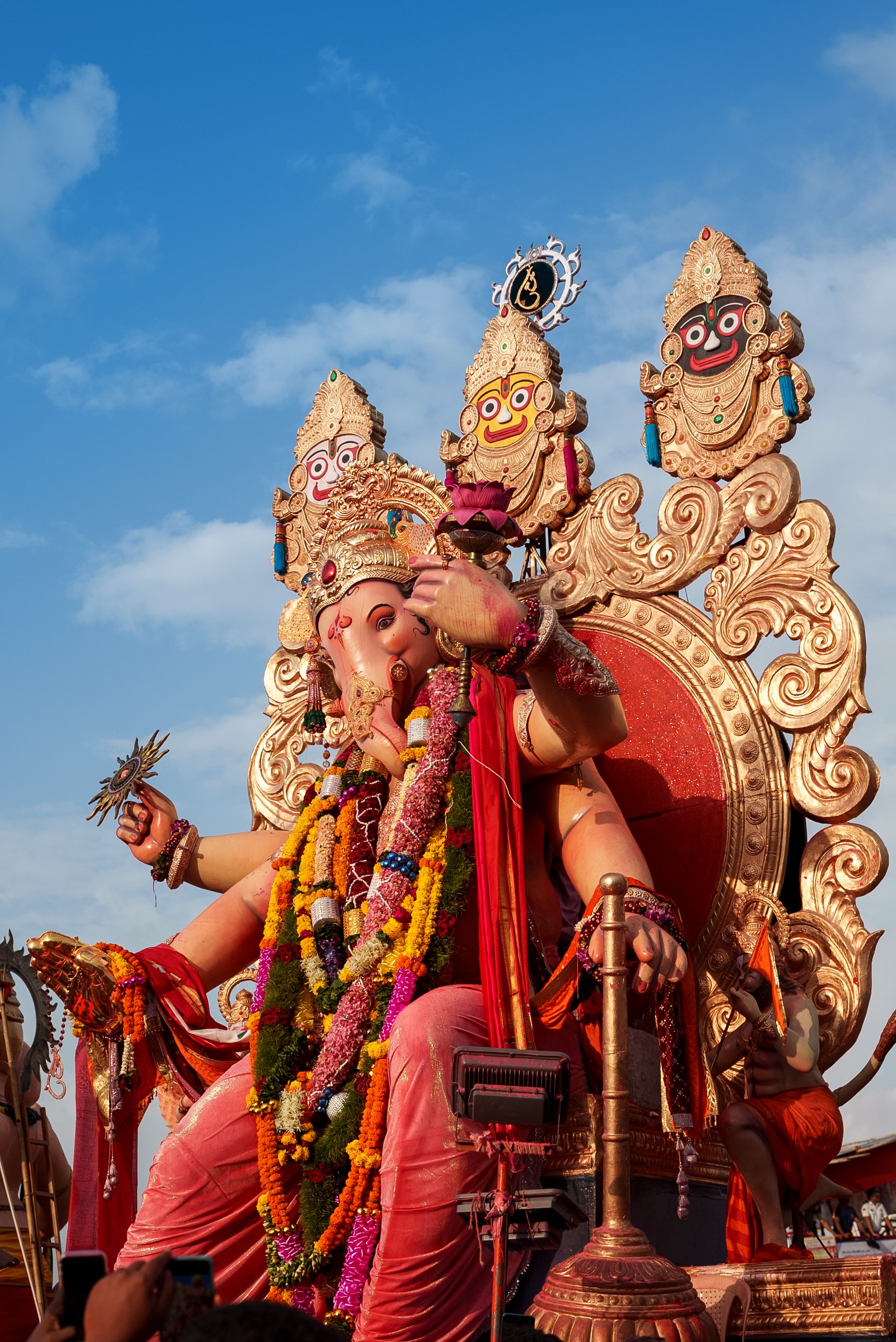 A vibrant Ganesh idol adorned with flowers during Ganesh Chaturthi festival in Mumbai, India.