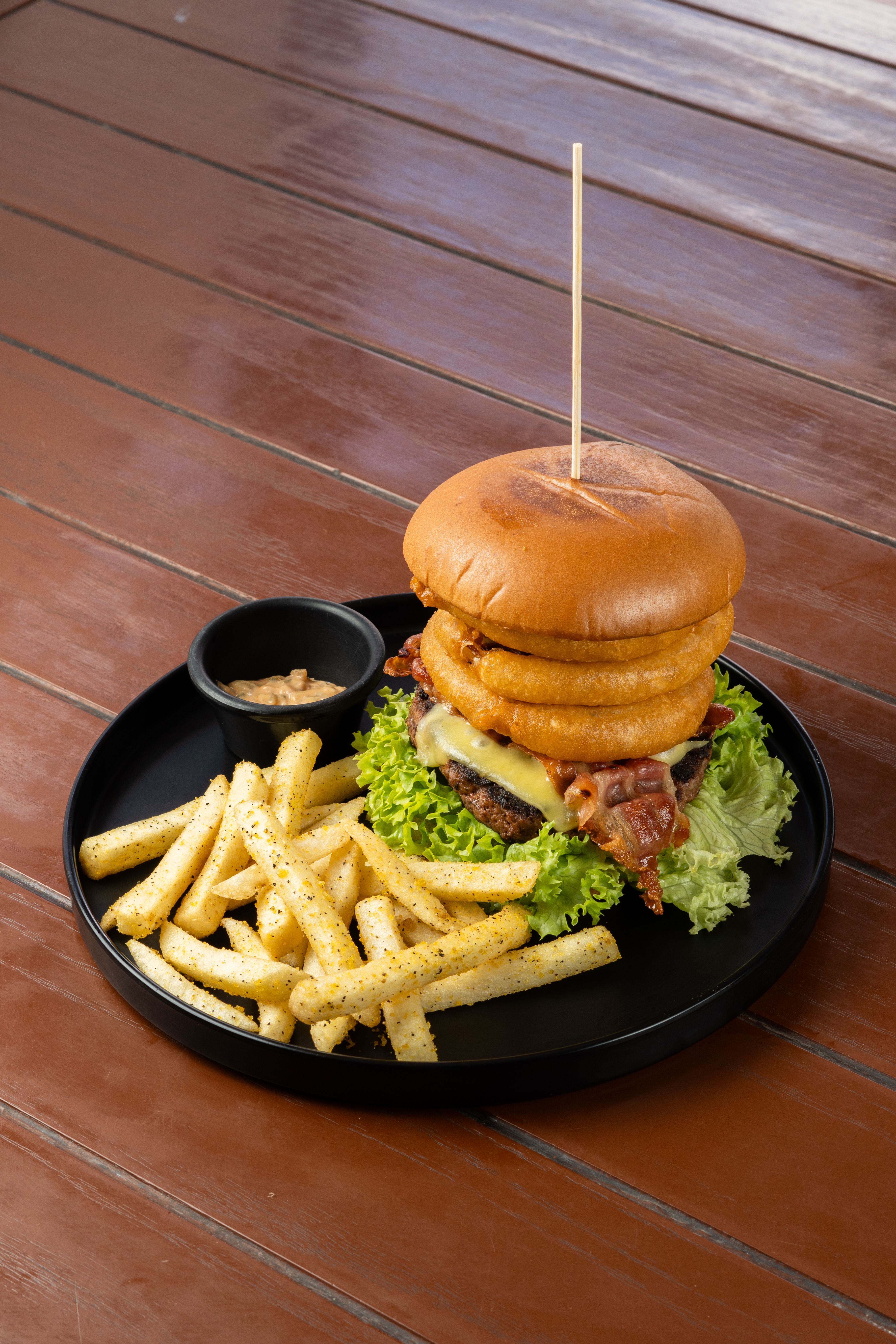 Gourmet Burger and Fries on Rustic Table · Free Stock Photo