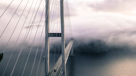 Fog-covered suspension bridge, photo by Nikolai Ulltang on Pexels