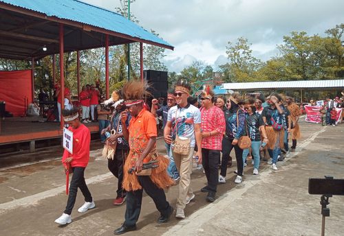 Free Joyful parade with traditional attire in Agats, Papua, Indonesia during the day. Stock Photo