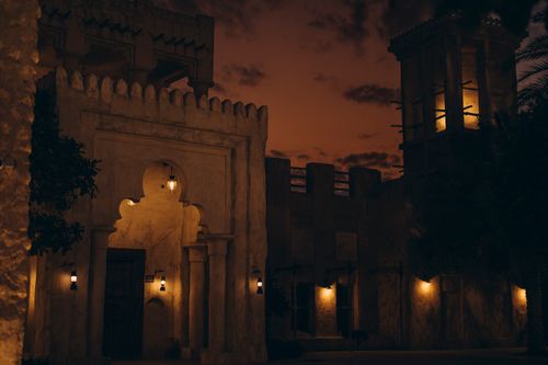 Free Stunning nighttime view of Al Shindagha's traditional architecture in Dubai, UAE. Warm lighting enhances historic charm. Stock Photo