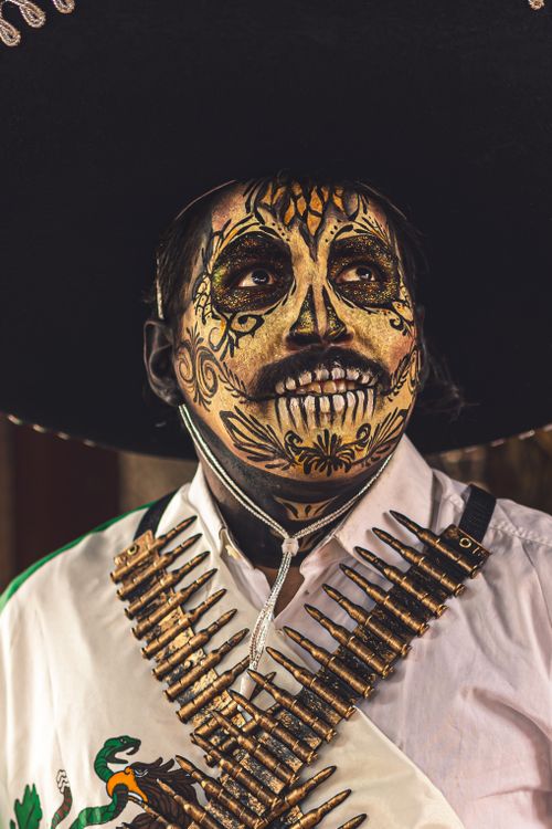 Free A striking portrait of a person wearing Day of the Dead makeup and traditional attire in CDMX, Mexico. Stock Photo