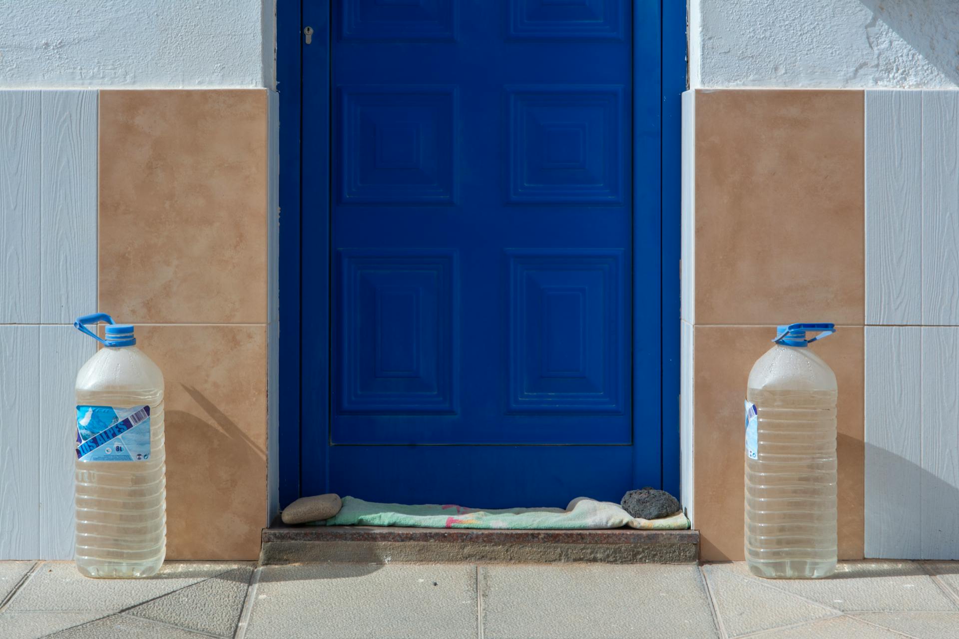 Blue Door with Two Water Containers
