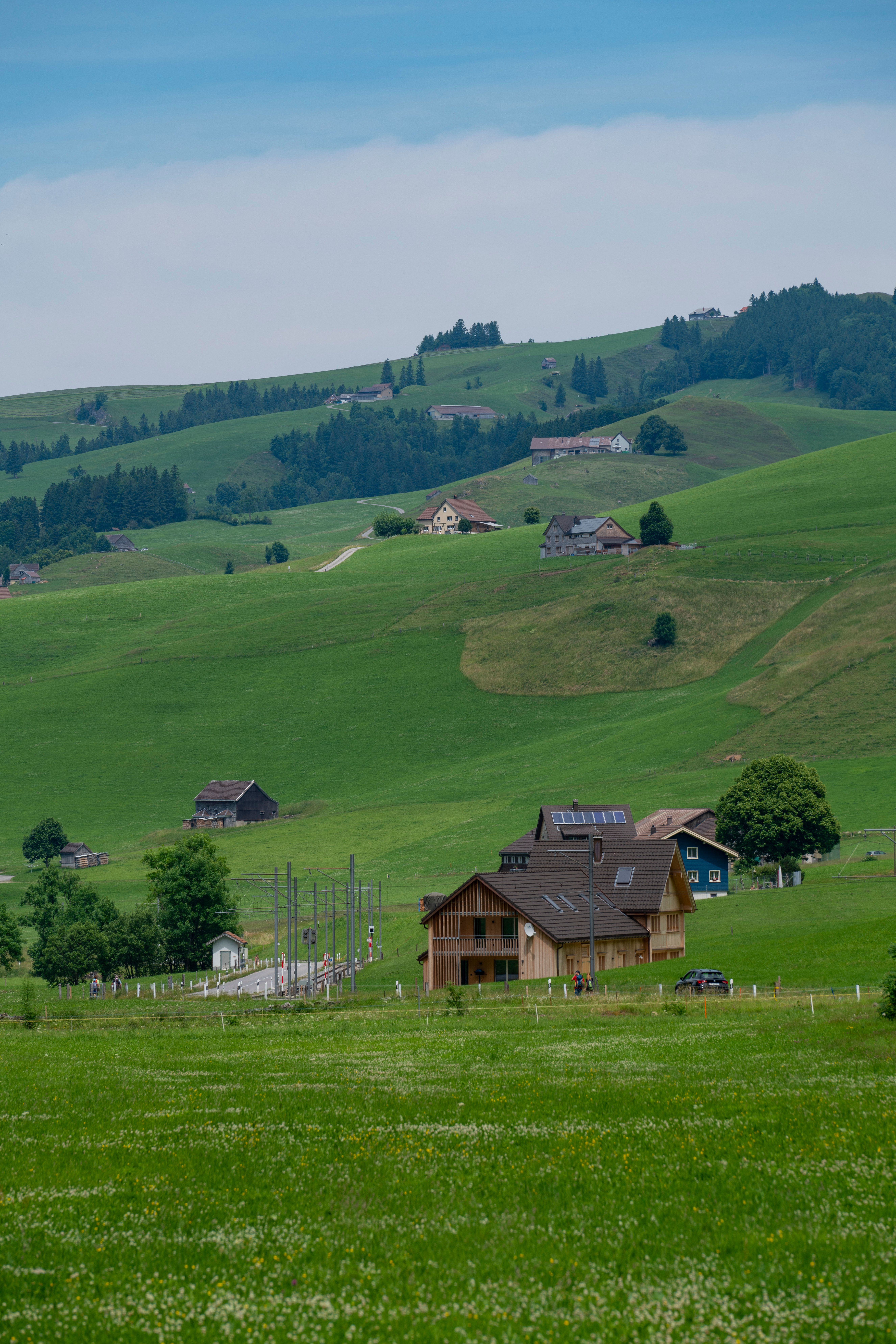Scenic View of Countryside Houses and Green Hills · Free Stock Photo