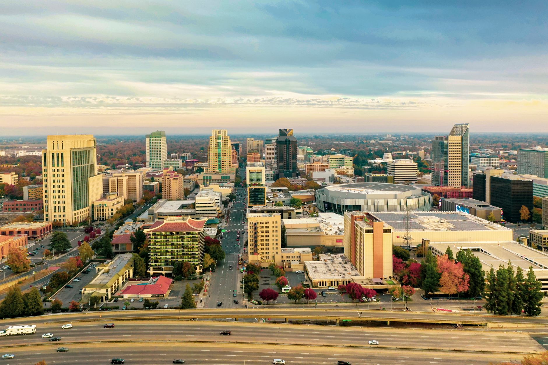 Stunning aerial view of downtown Sacramento skyline with landmarks and autumn foliage.