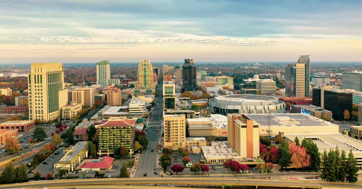 Stunning aerial view of downtown Sacramento skyline with landmarks and autumn foliage.
