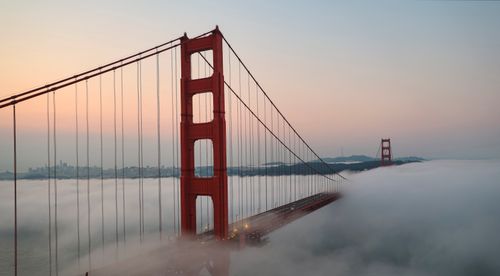 Free Golden Gate Bridge emerging through the morning fog at sunrise, San Francisco. Stock Photo