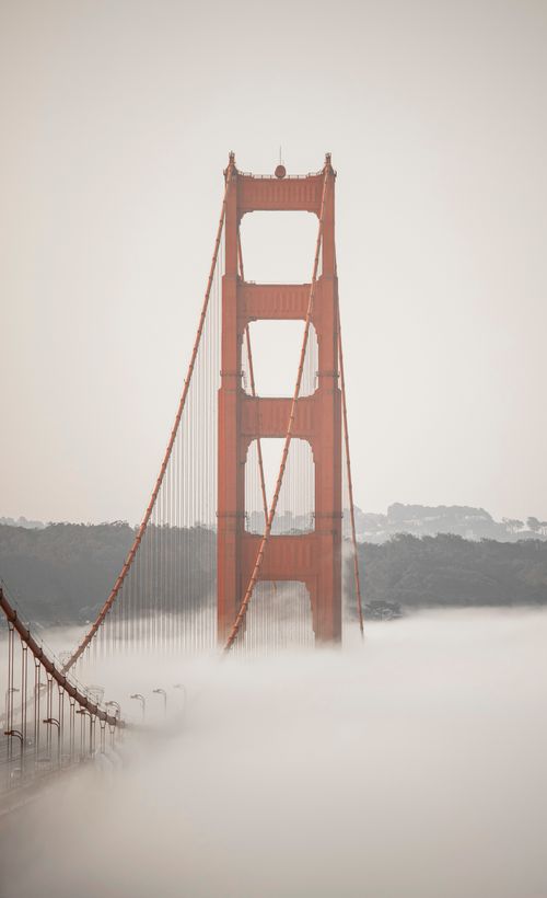 Free Iconic Golden Gate Bridge shrouded in mist, creating a dreamy San Francisco view. Stock Photo