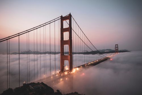 Free Stunning aerial view of the Golden Gate Bridge enveloped in morning fog. Stock Photo