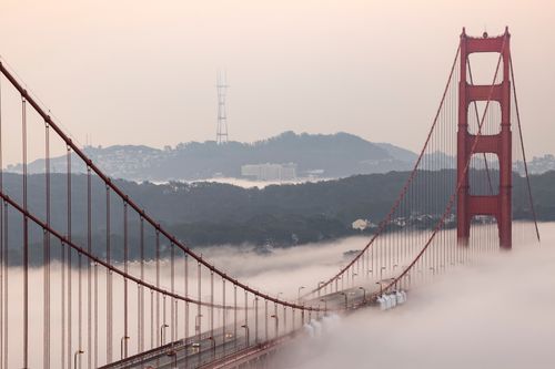 Free Iconic Golden Gate Bridge enveloped in a dreamy morning fog captured from above San Francisco. Stock Photo