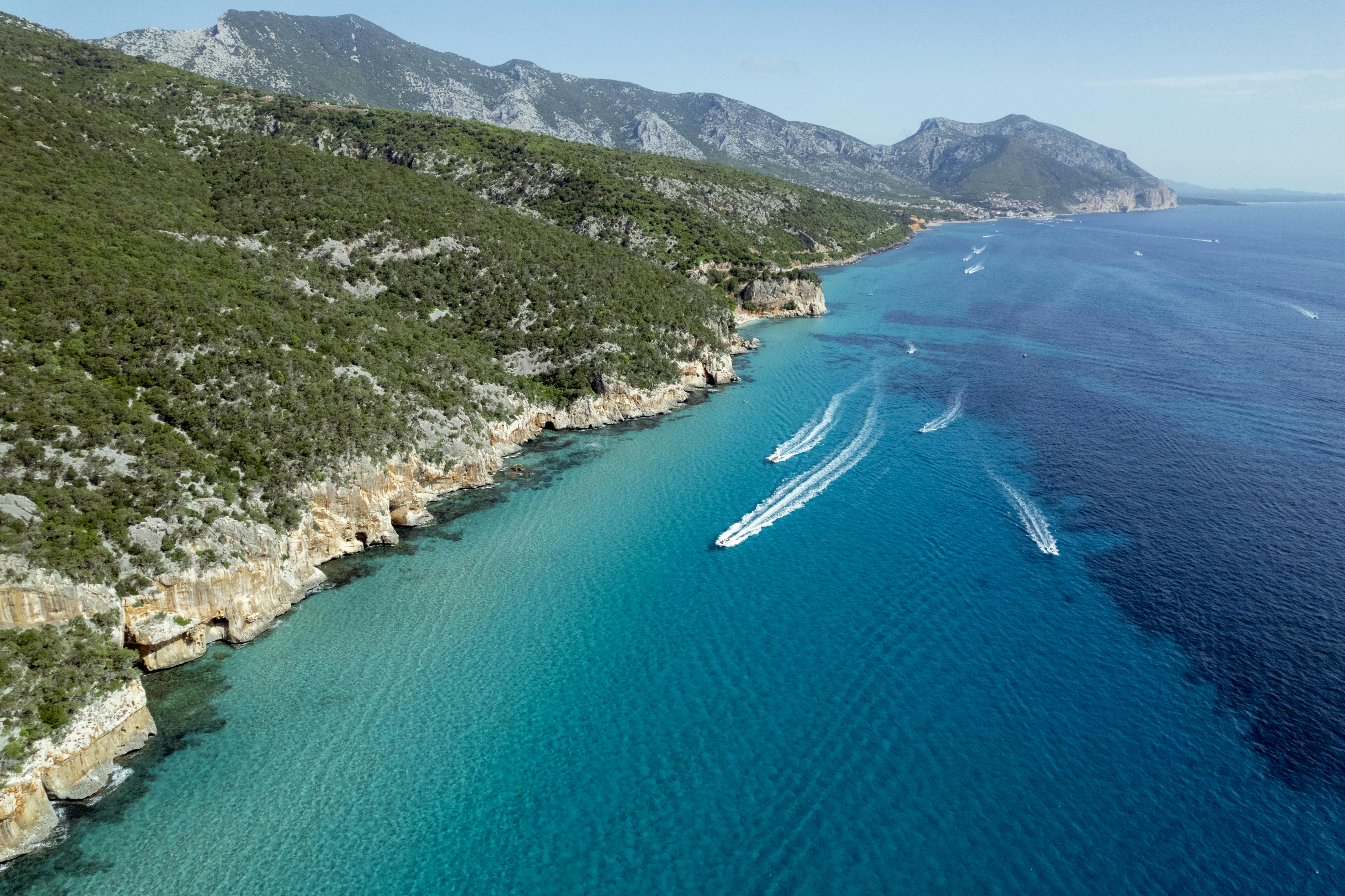 Explore the stunning cliffs and azure waters of Sardinia