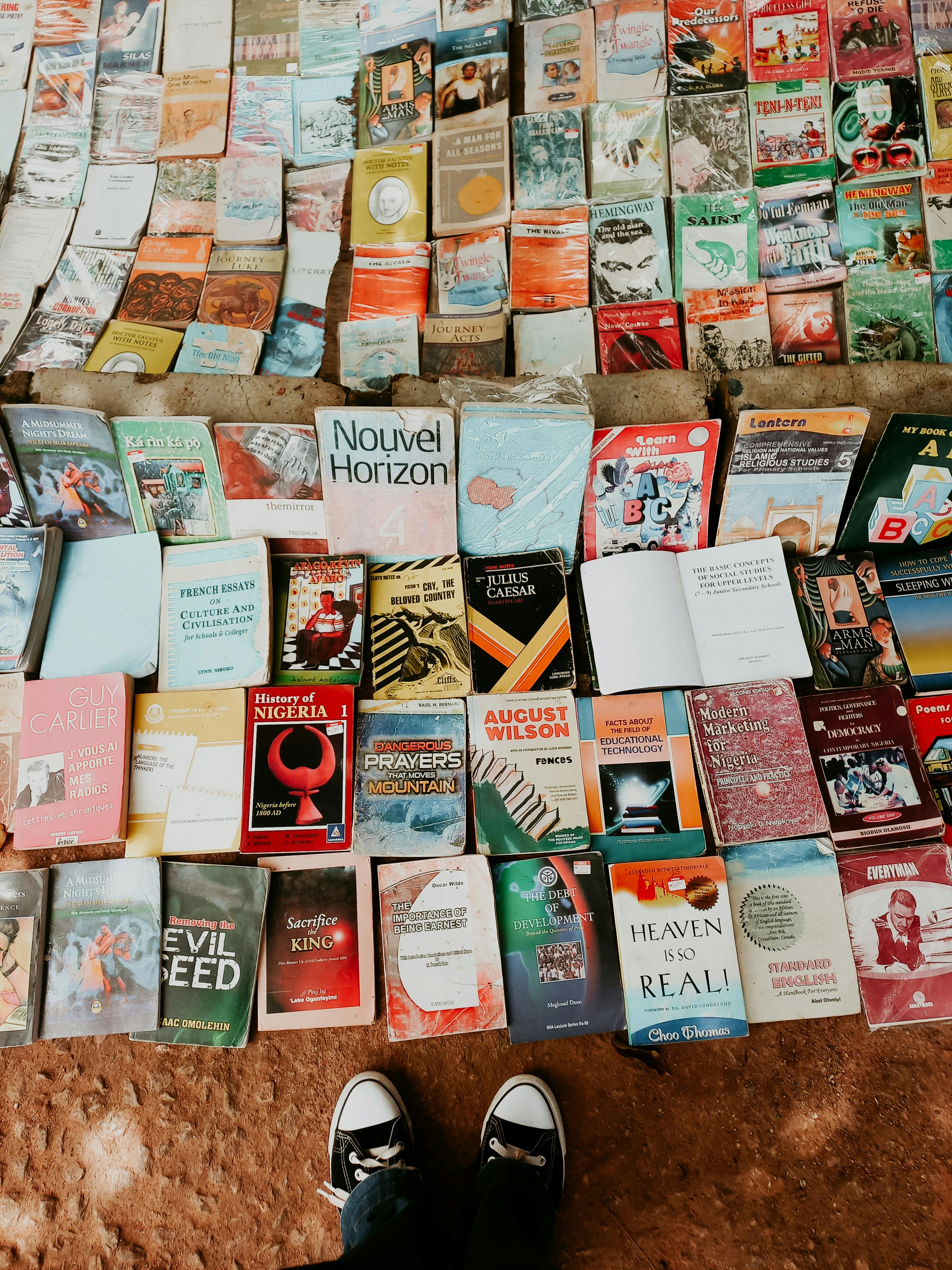 colorful assortment of books on display at a market