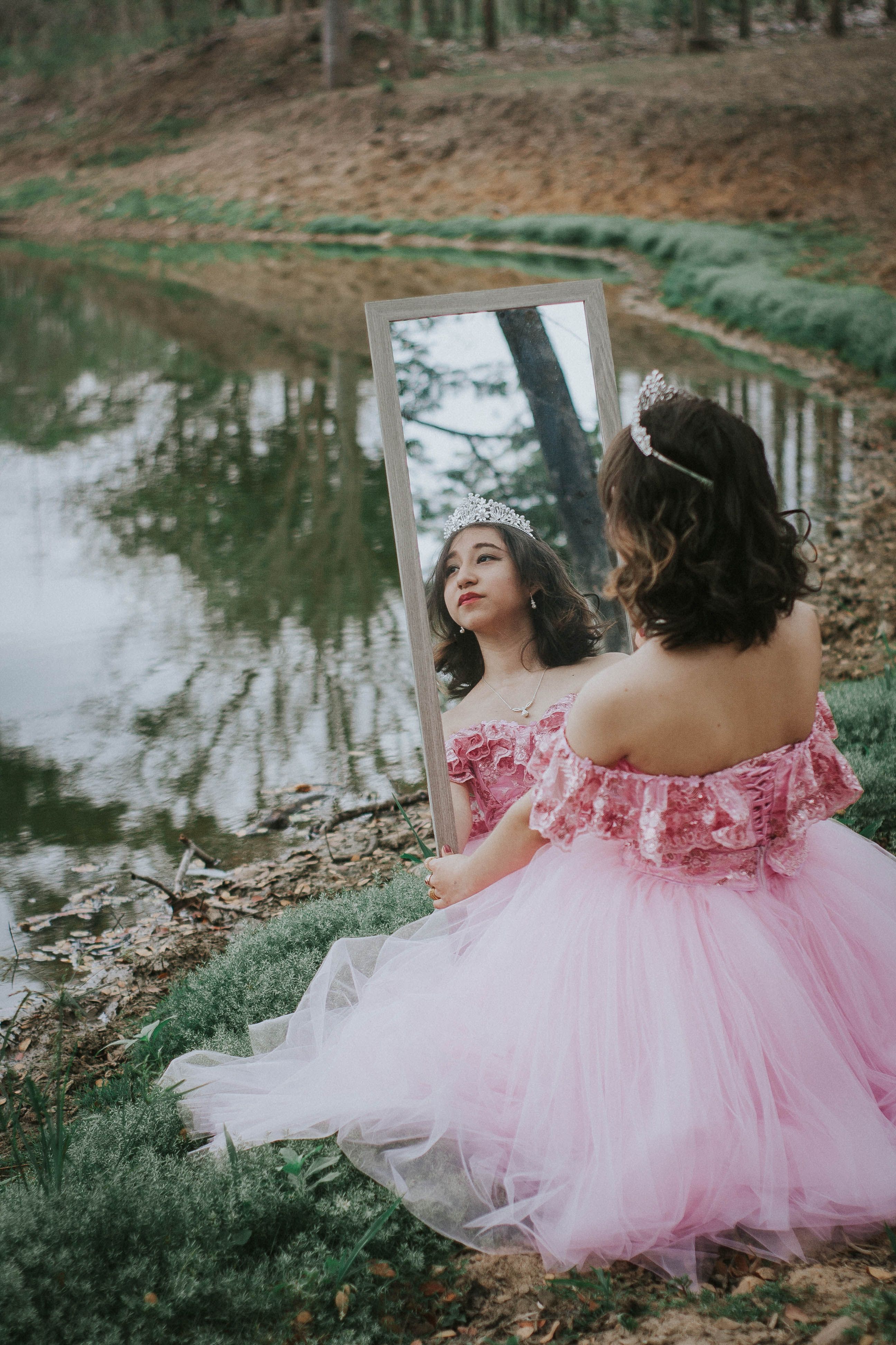 Young Woman in Pink Dress Reflecting by Lake · Free Stock Photo