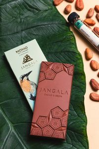 Artisanal dark chocolate block with cocoa beans — photo by Sergio Arreola on Pexels