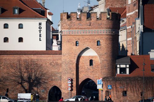 Free Historic brick gate showcasing medieval architecture in a European city. Stock Photo