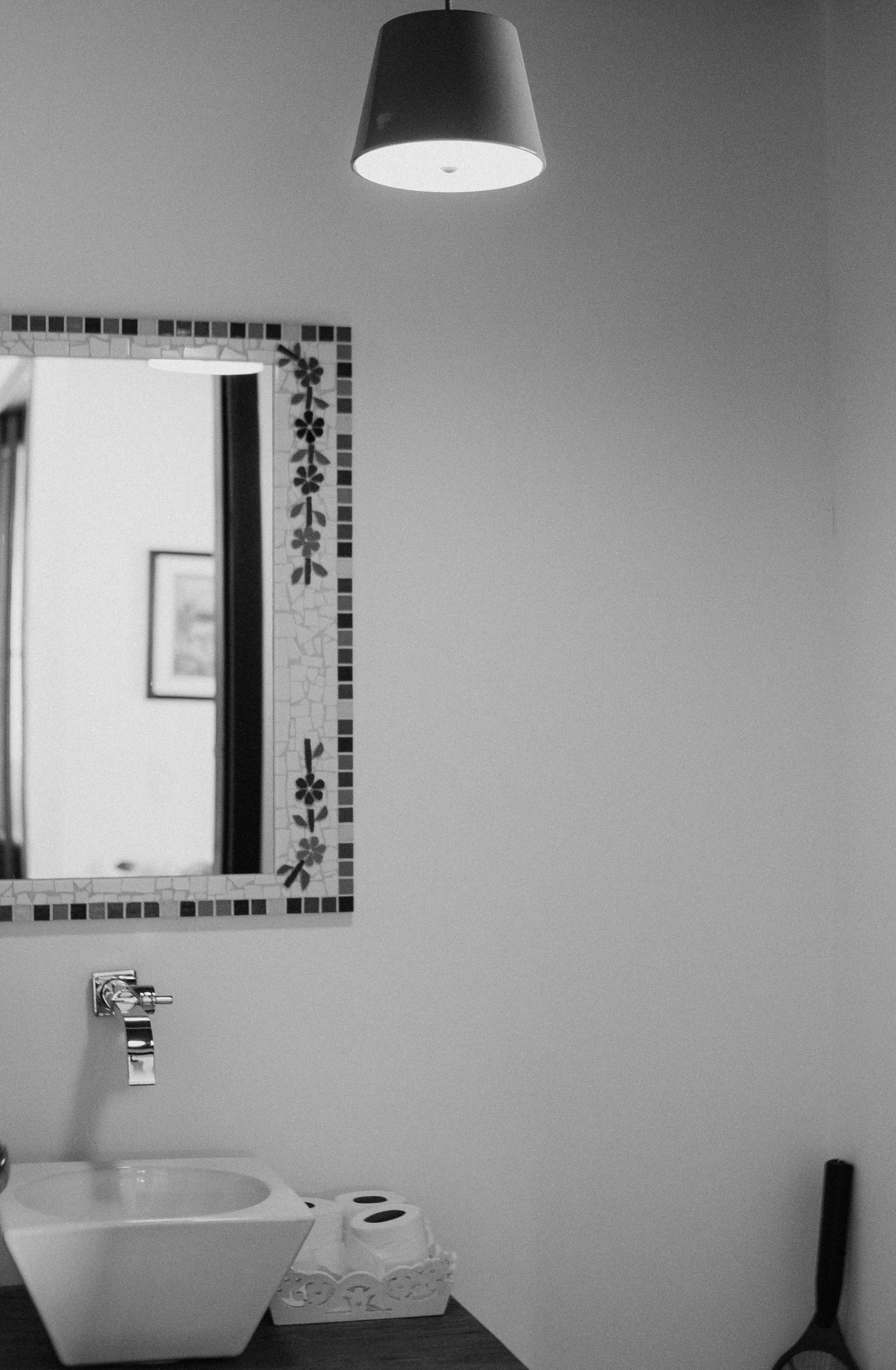 Minimal black and white bathroom with square sink, mirror and clean geometric lines