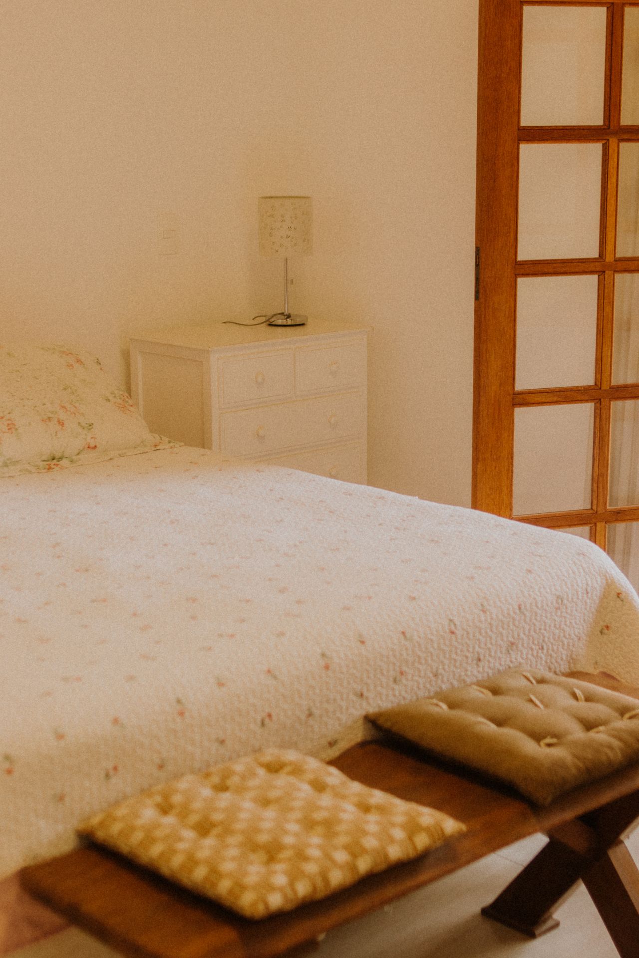 cozy-bedroom Warm cozy bedroom with soft lighting and comfortable bed