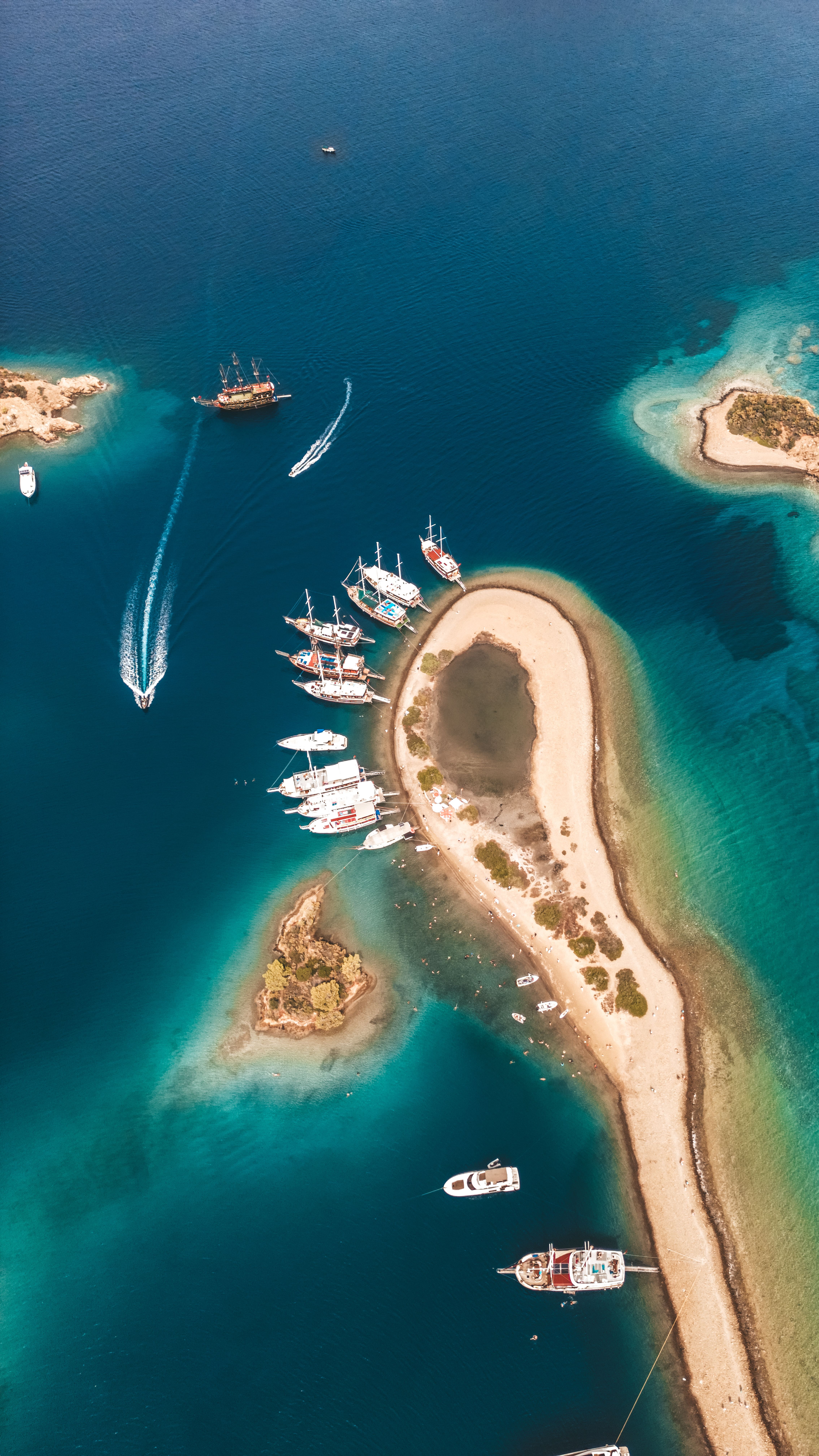 Aerial View of Boats on Pristine Blue Water Coastline · Free Stock Photo