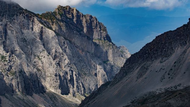 Stunning view of a dramatic mountain landscape under a crisp blue sky.