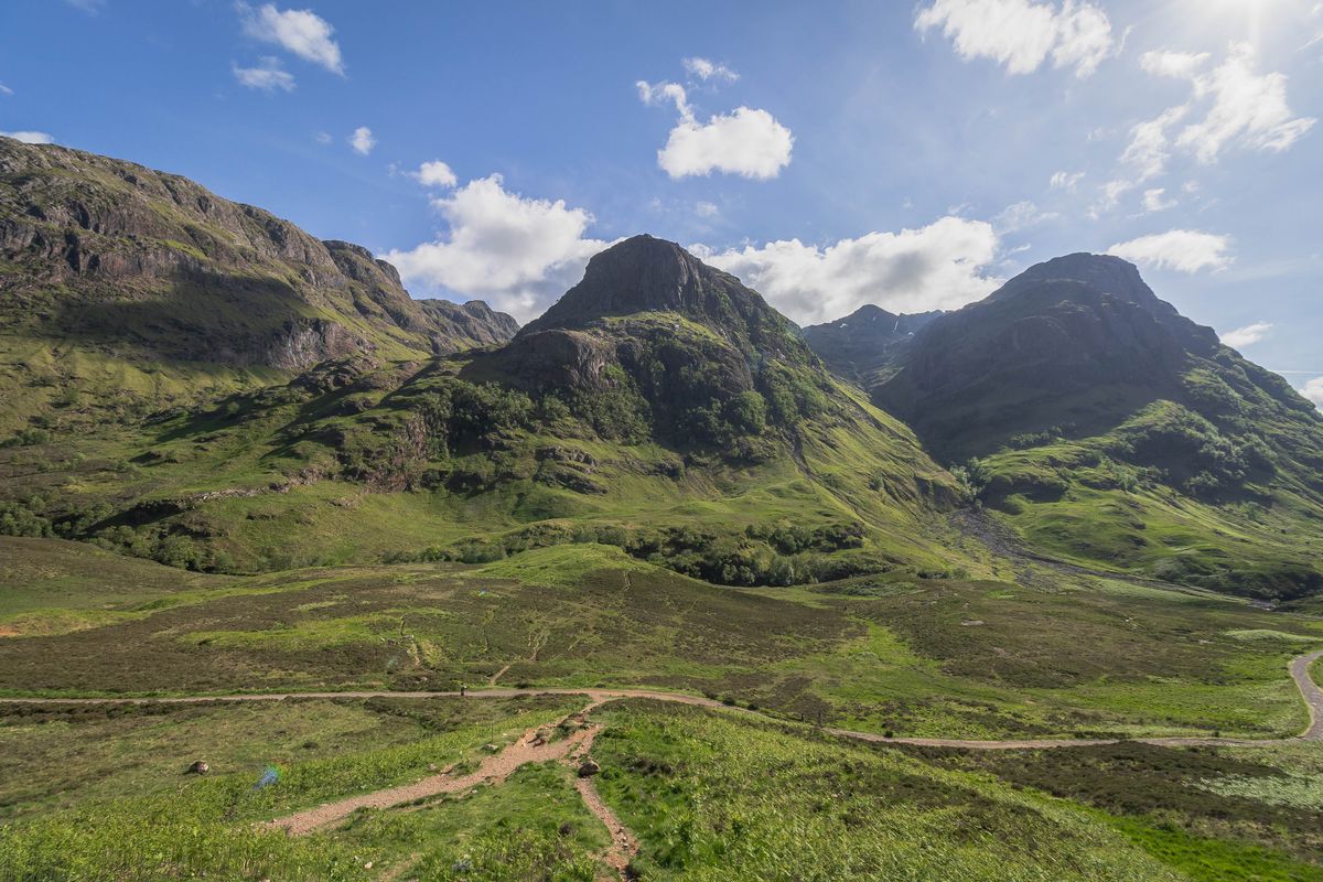 The Three Sisters ridges rising above Glencoe under a summer sky
