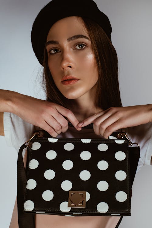 Free Photo of Woman Holding Polka Dots Bag Stock Photo