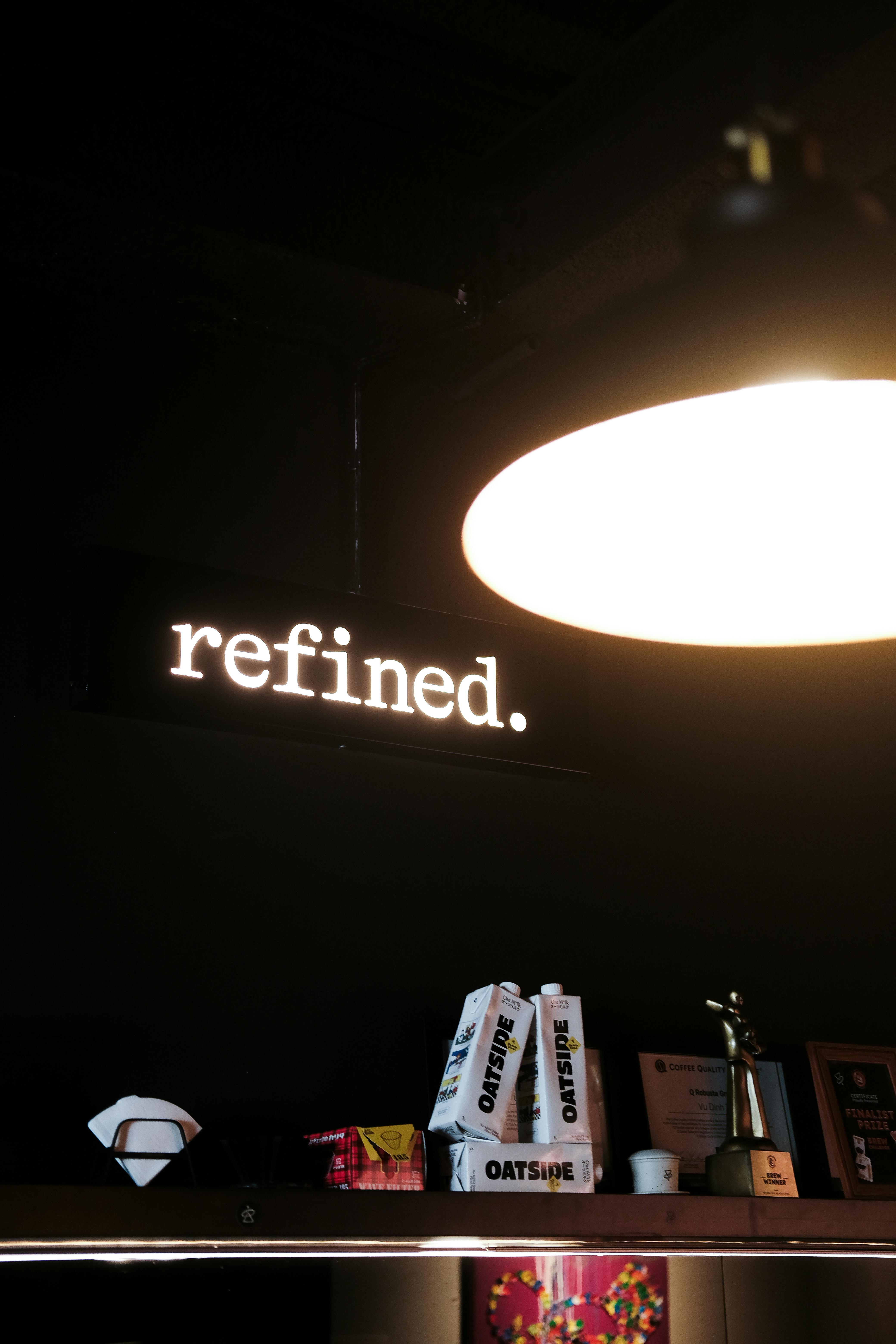 Dimly lit cozy coffee shop interior in Hà Nội showcasing a vintage lamp and decor.