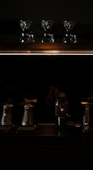 Sleek coffee machines and accessories in a contemporary kitchen.