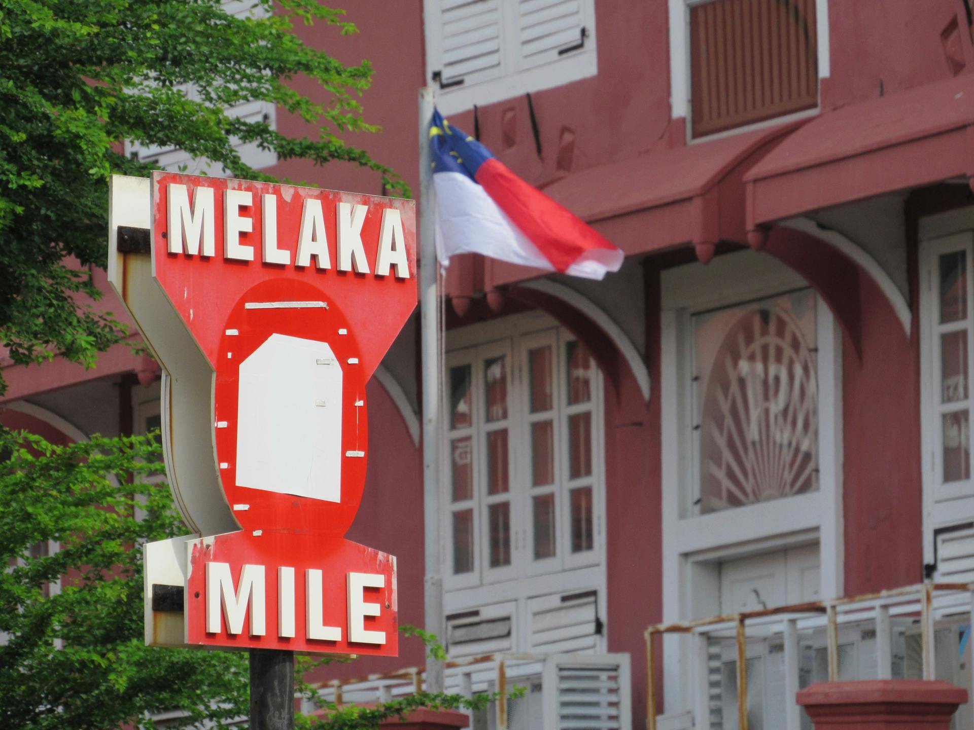 Melaka Mile Sign with Malaysian Flag
