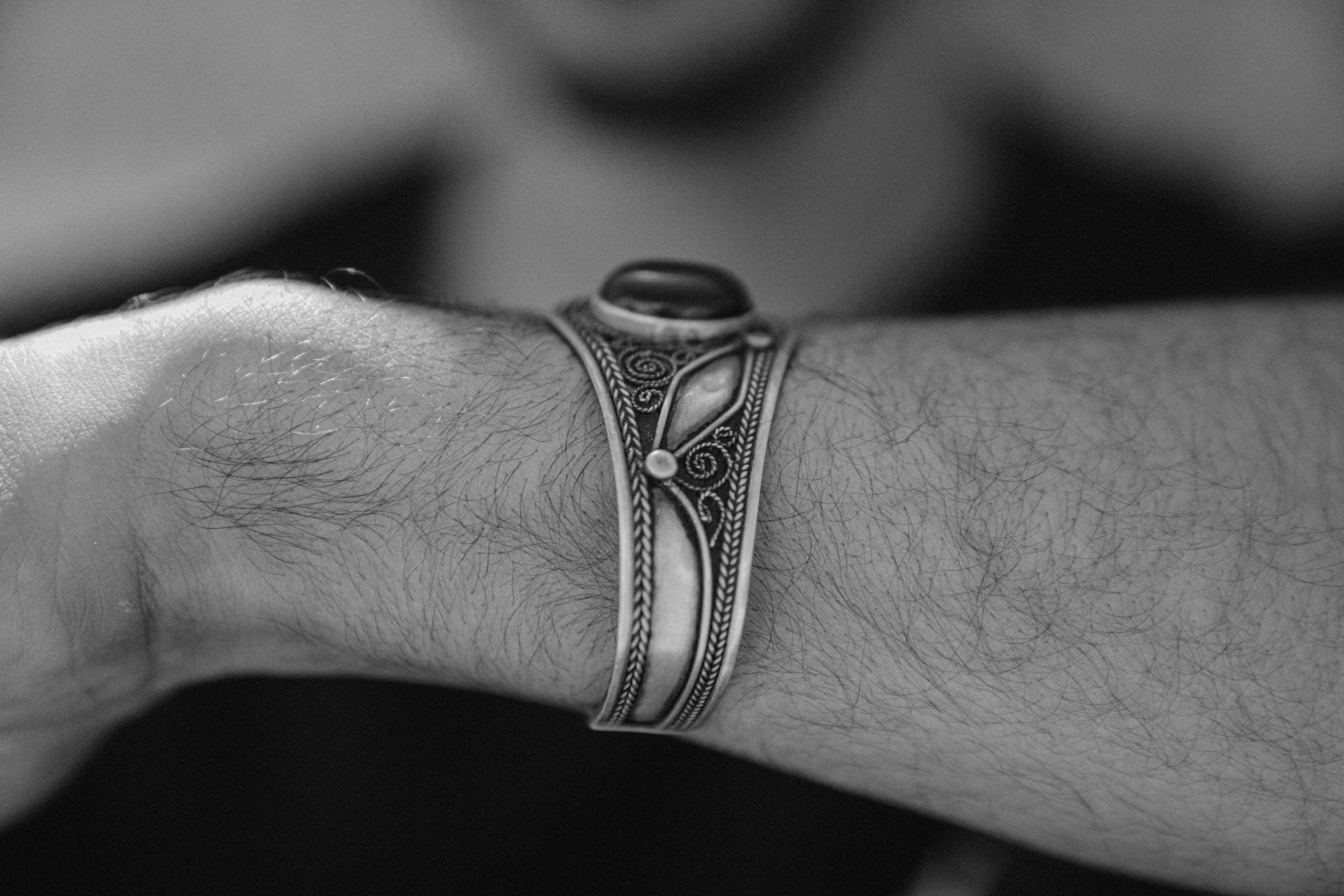 Tibetan three metal bracelet - Close-up of a traditional Moroccan silver bracelet worn on a man's wrist. | Buddhabelief