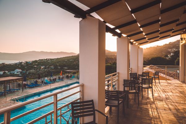 Pool terrace at dusk — photo by Matthias Groeneveld on Pexels
