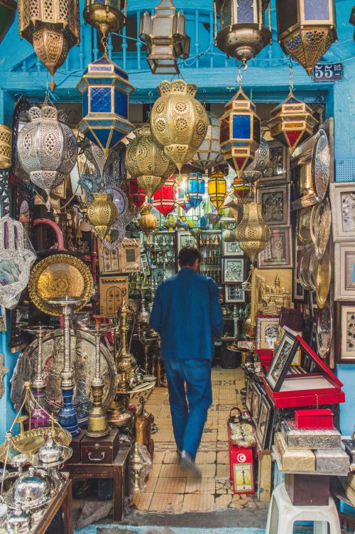 Free A bustling market shop filled with colorful, intricate lamps and vintage decor in a vibrant, exotic setting. Stock Photo