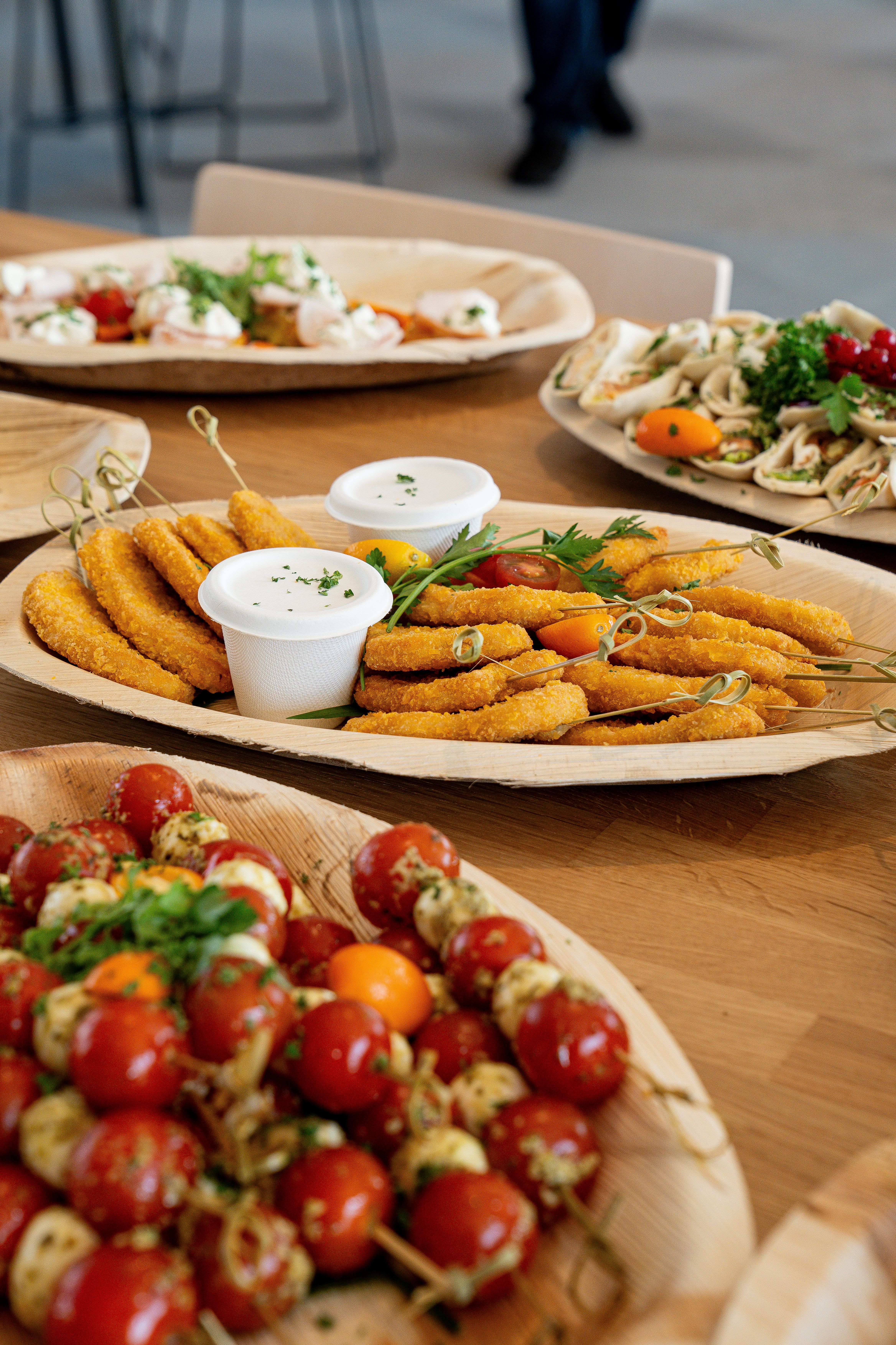 Assorted appetizer platter with salad skewers and dips