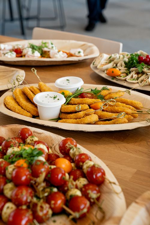 Assorted appetizer platter with salad skewers and dips