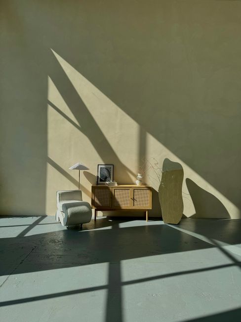 Sunlight casts geometric shadows on a minimalist interior in Kyiv, Ukraine.