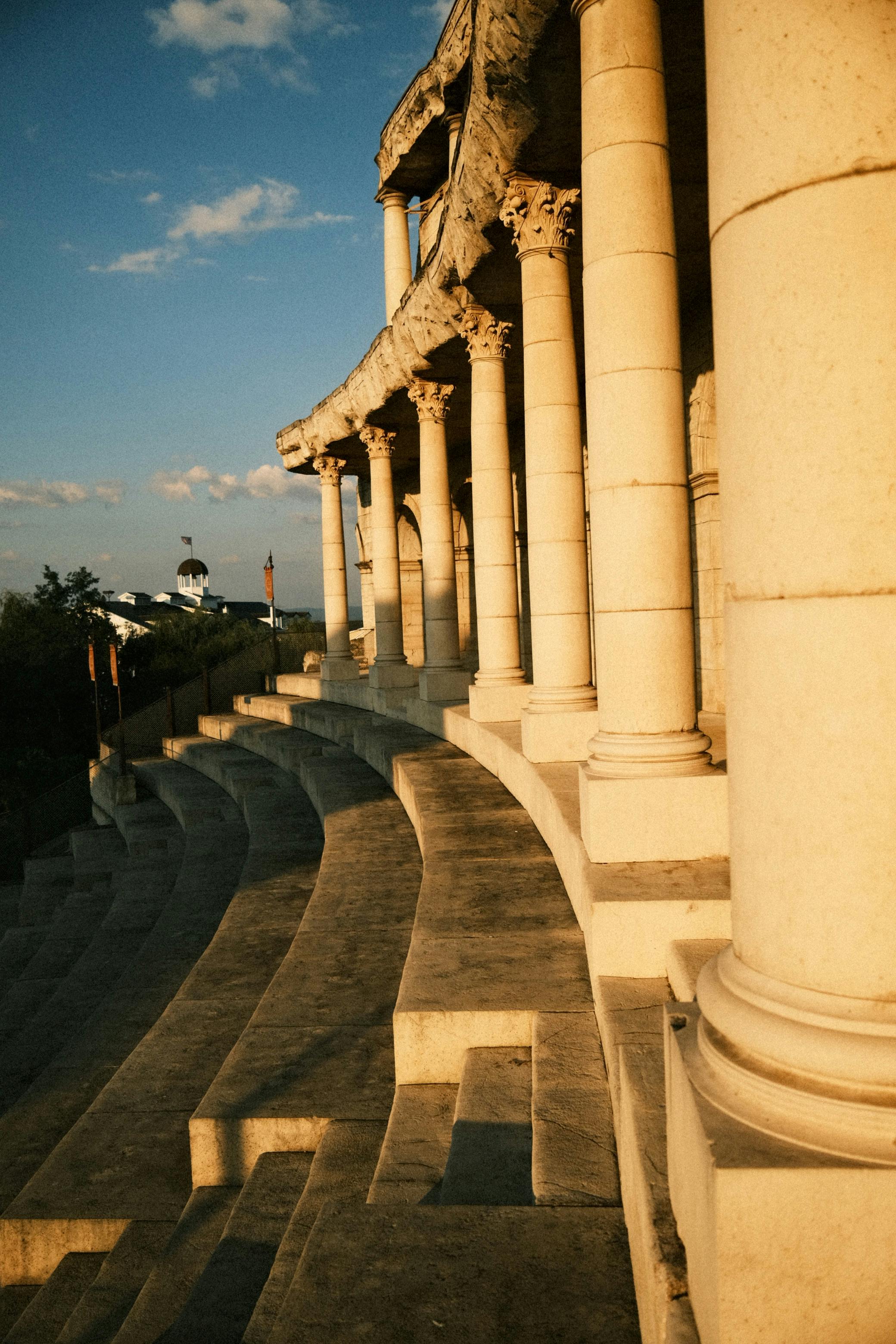 Free Golden hour light on an ancient Roman amphitheater with stunning columns. Stock Photo