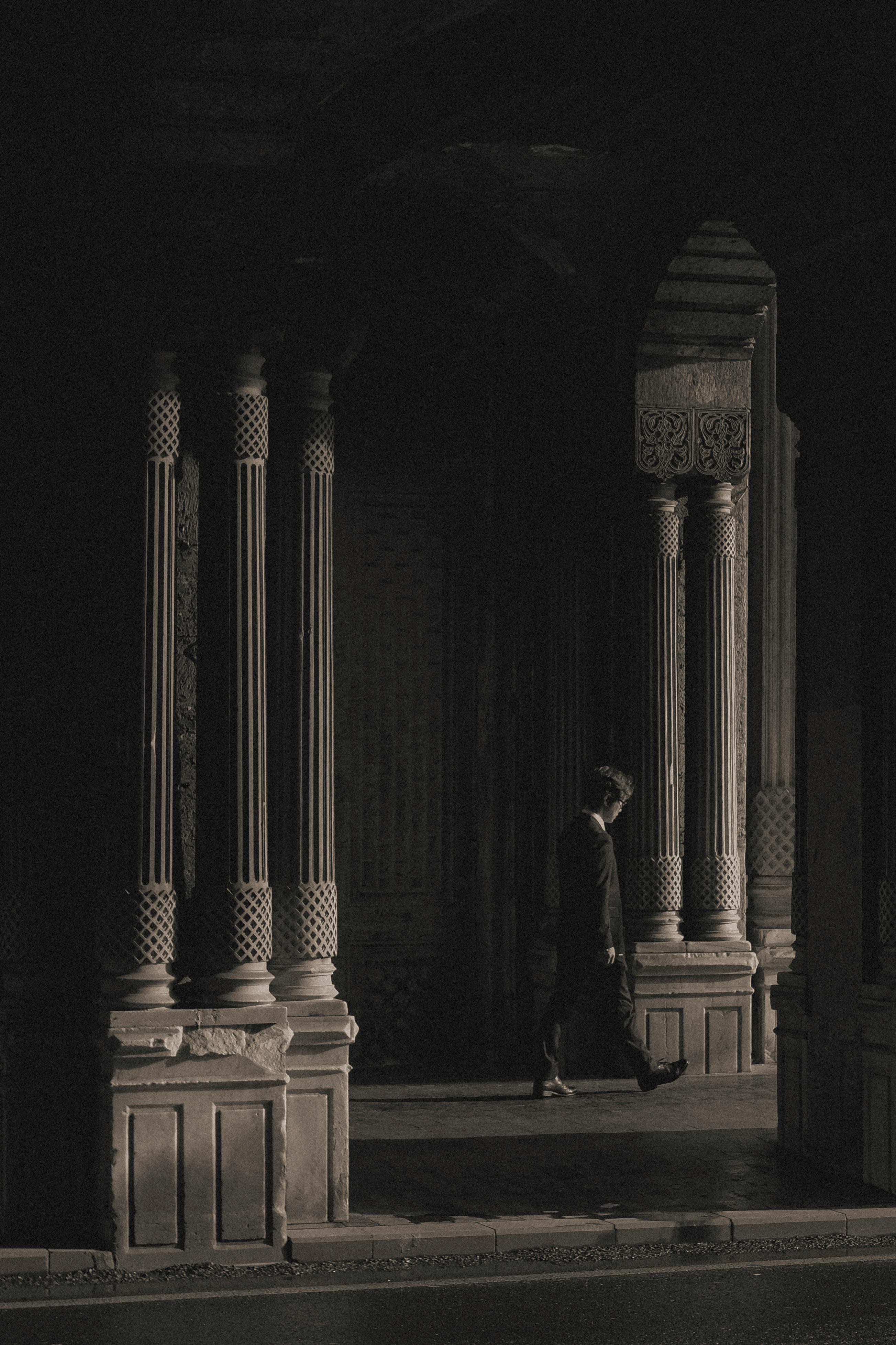 Free Moody black and white photograph of Ottoman architecture in Istanbul, featuring detailed columns and shadows. Stock Photo