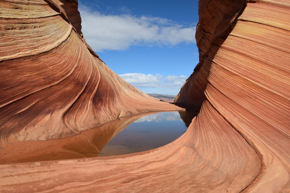 Explore the breathtaking swirling rock formations at The Wave in Arizona's desert landscape.