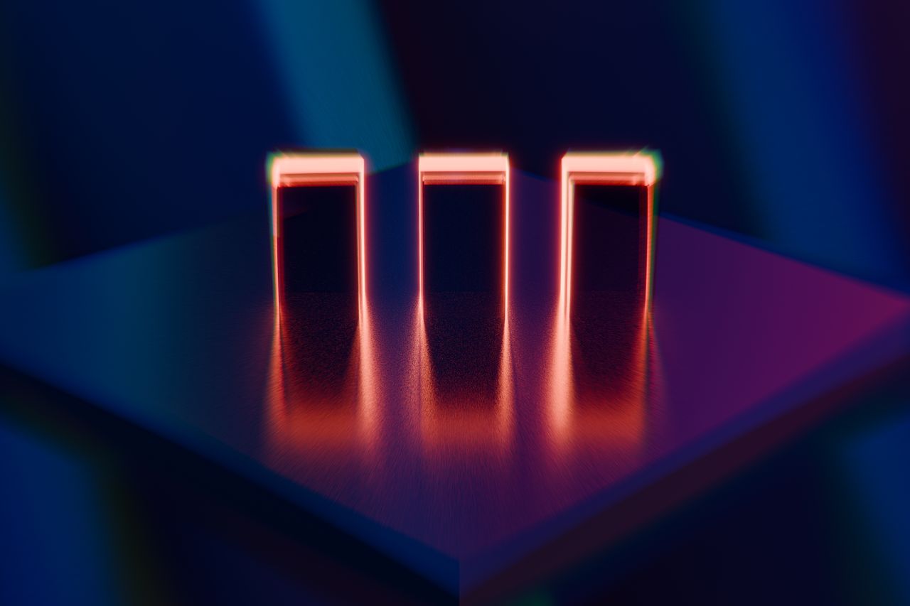 abstract image of three neon lit blocks reflecting on a surface creati