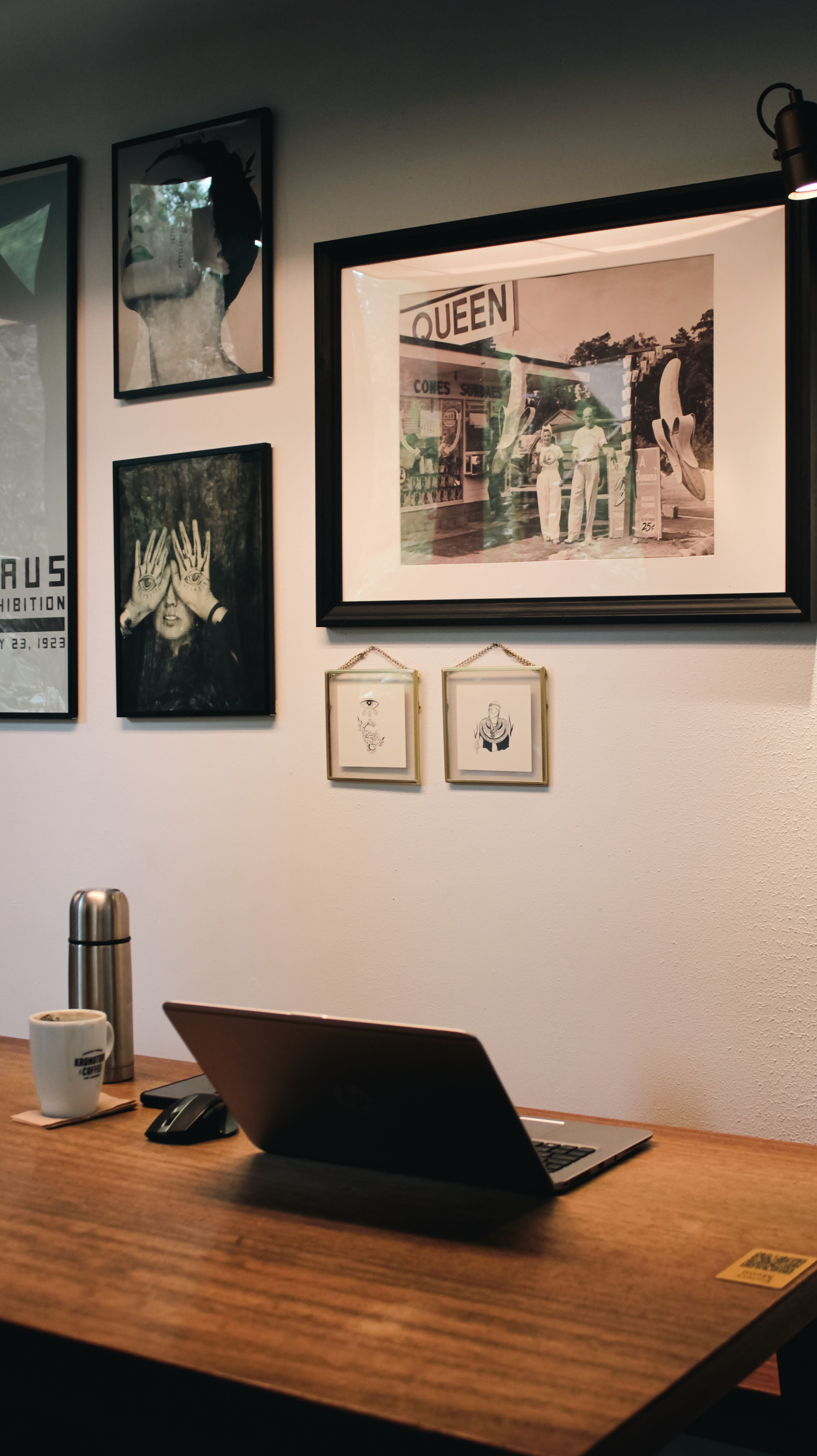 Cozy Home Office Desk with Laptop and Wall Art · Free Stock Photo