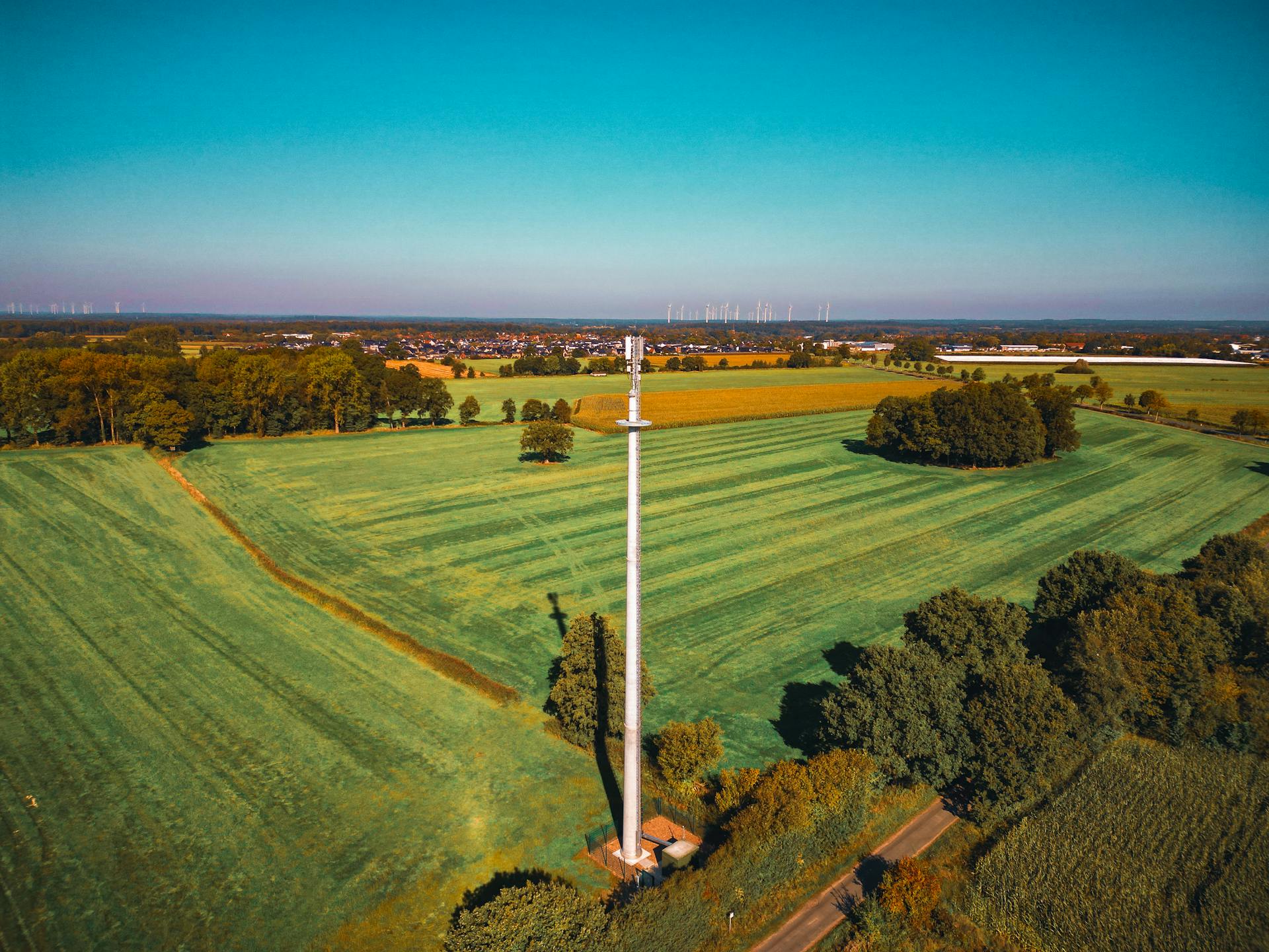 Aerial View of Communication Tower in Green Fields