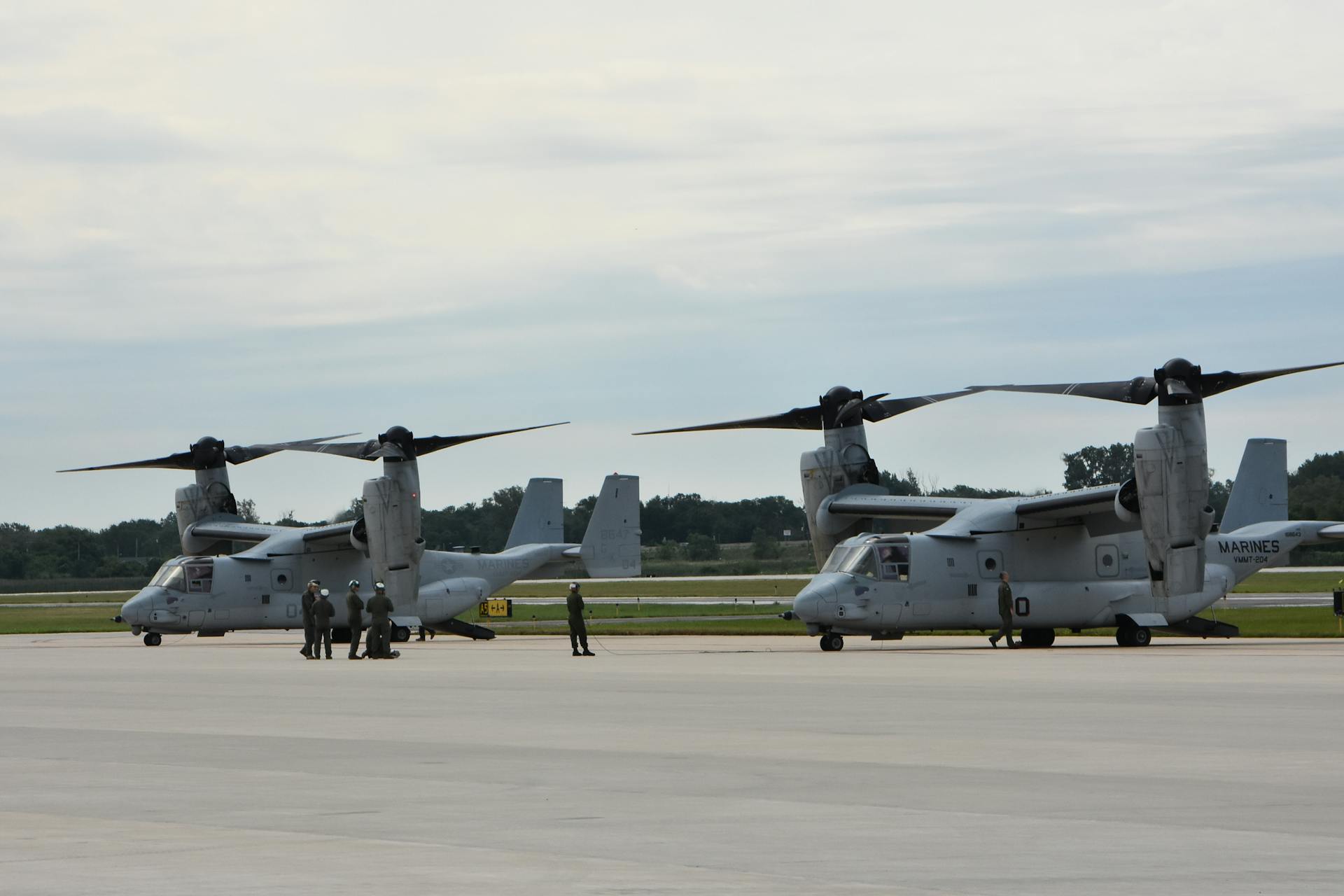 Military Aircraft at Airbase with Personnel