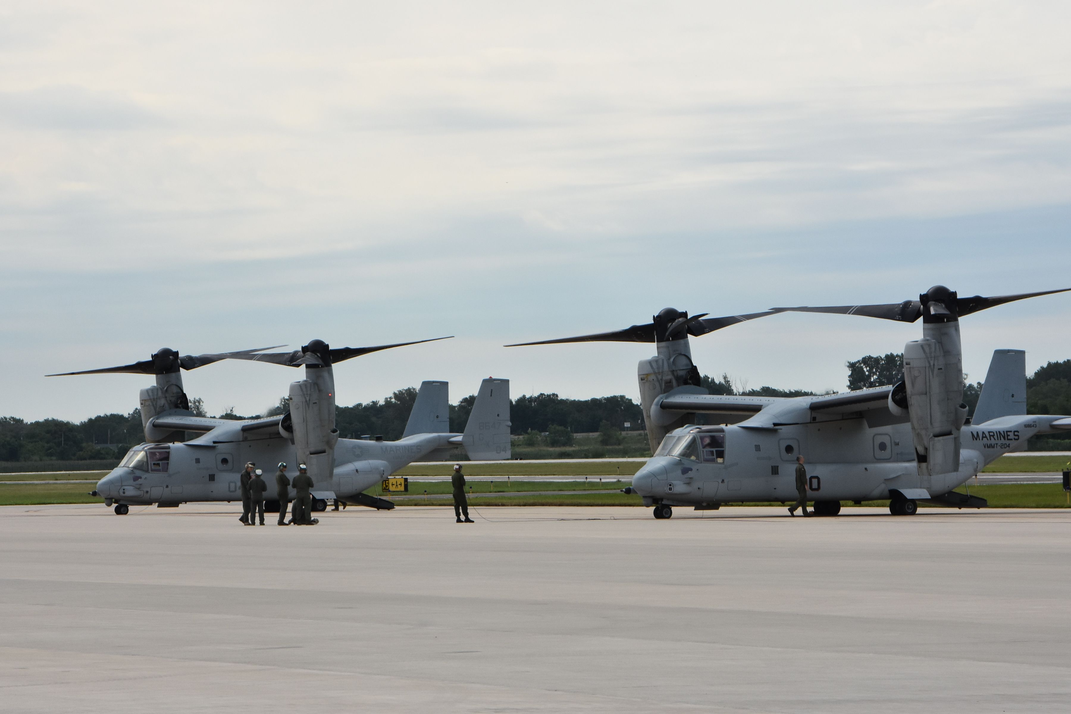 Military Aircraft at Airbase with Personnel · Free Stock Photo
