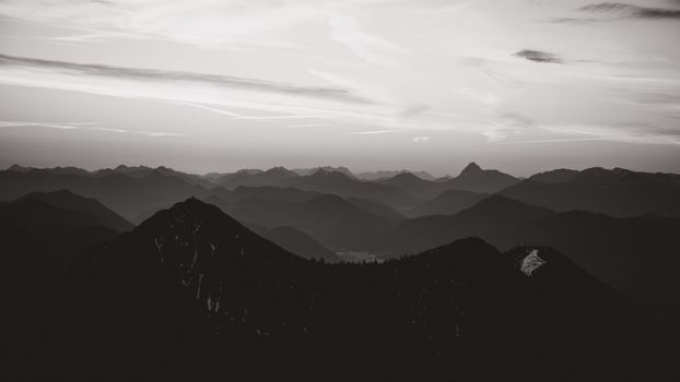 Captivating panoramic view of the Bavarian Alps at sunrise, showcasing nature's grandeur.