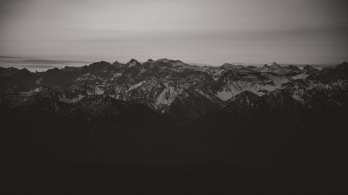 Free Majestic view of Garmisch-Partenkirchen's rugged mountain peaks in the Bavarian Alps during twilight. Stock Photo