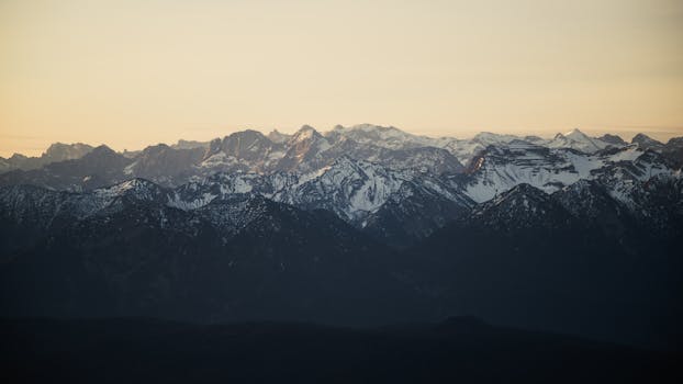 Beautiful sunrise view over the snow-capped Bavarian Alps in Garmisch-Partenkirchen, Germany.