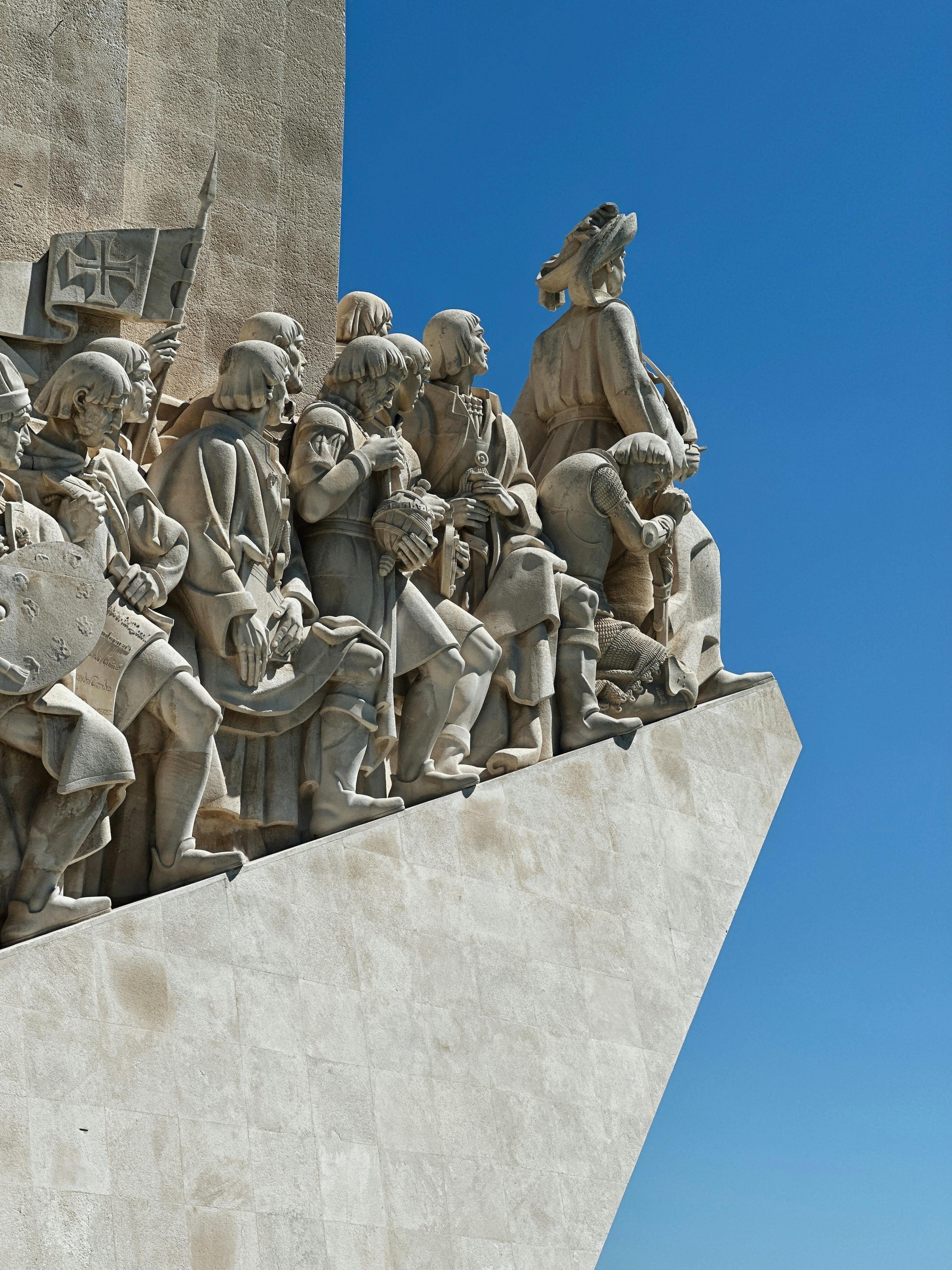 Close-up of Monument to the Discoveries in Lisbon with clear blue sky.