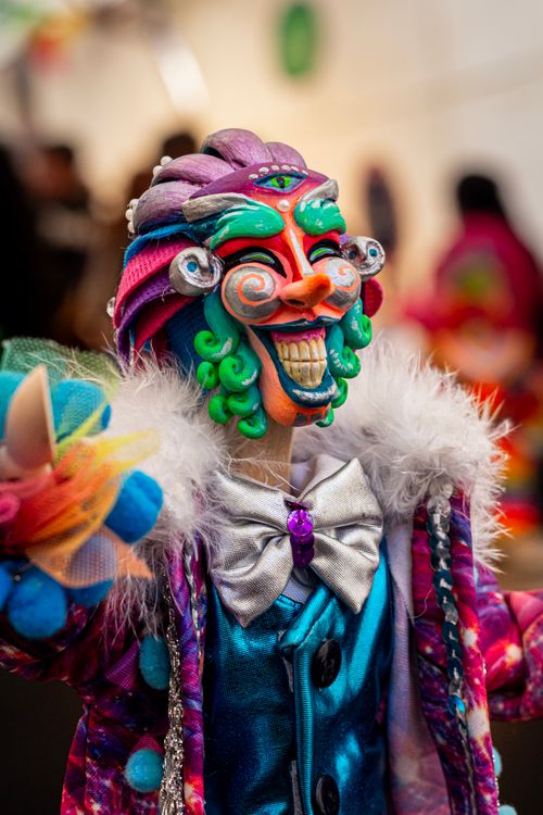 Free Close-up of a vibrant carnival mask with intricate colorful costume and joyful expression. Stock Photo