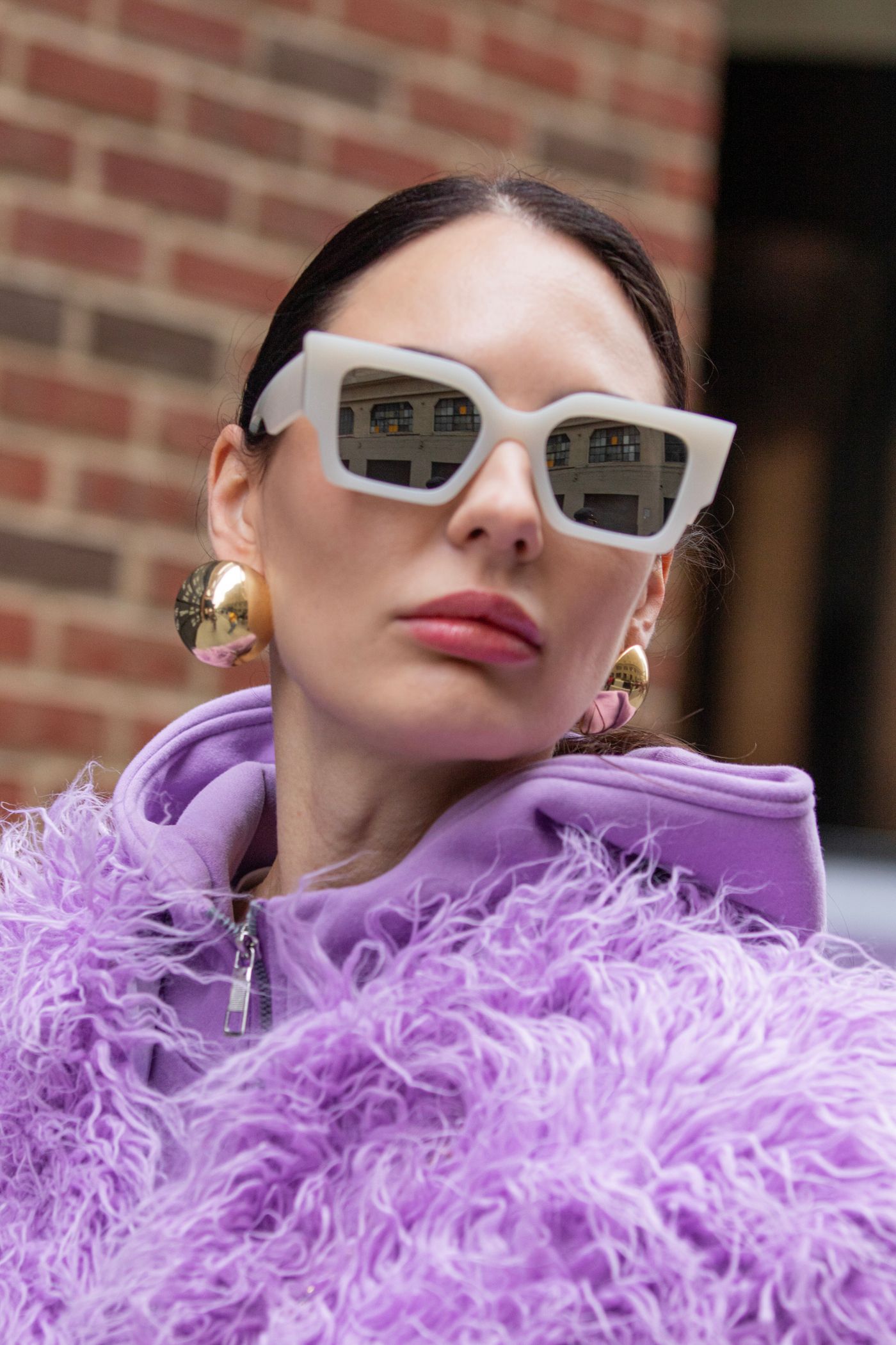 A chic fashion portrait in New York City — statement sunglasses in the city