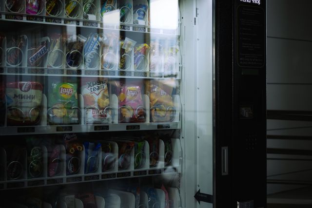 Large glass-front vending machine with multiple product rows
