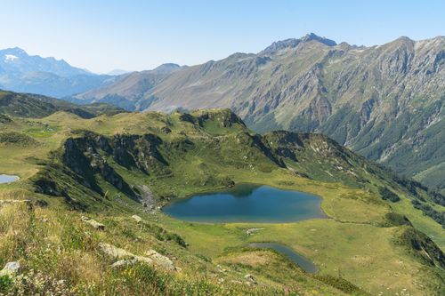 Free A breathtaking aerial view of Gagra's lush mountains and serene lakes under a clear blue sky. Stock Photo